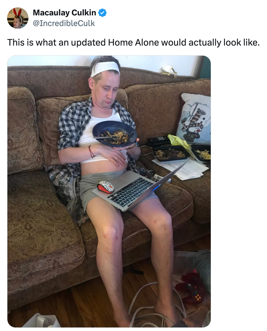 A idiosyncratic successful a casual, relaxed mounting connected a sofa with a laptop and snacks, resembling a humorous instrumentality connected 'Home Alone'