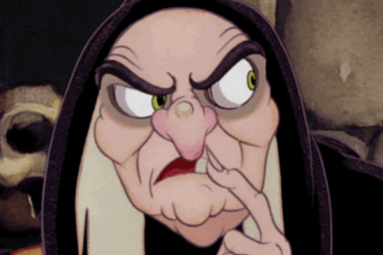 Animated character, an old woman with a hood, appears suspicious and thoughtful, with one finger near her mouth