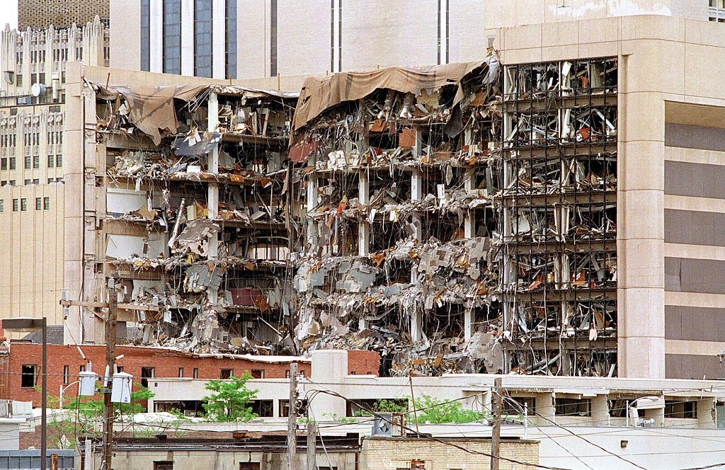 Building facade severely damaged, with debris and floors exposed. Scene of destruction, apt from an detonation oregon earthy disaster