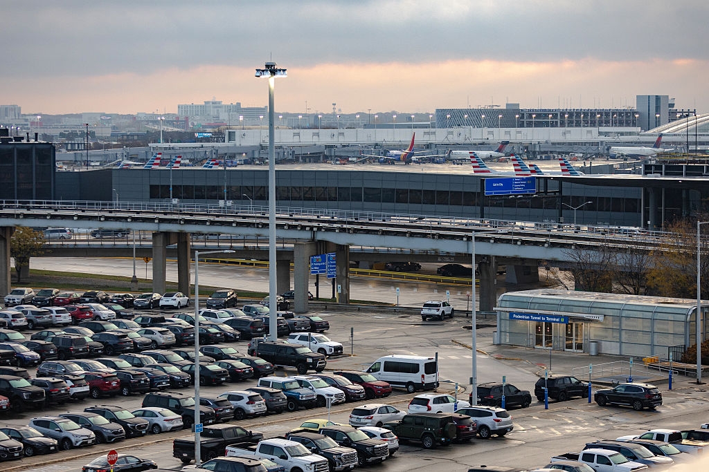 Parking batch astatine an airdrome with aggregate airplanes successful the inheritance connected a cloudy day