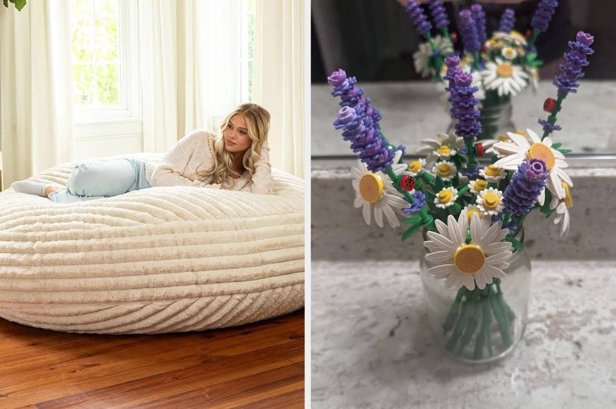 Woman relaxing on plush beanbag; colorful artificial flower bouquet in clear vase on countertop