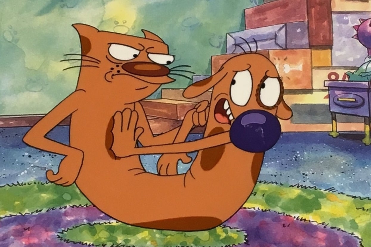 Cartoon characters of a conjoined cat and dog express contrasting emotions; the cat is annoyed, while the dog appears worried