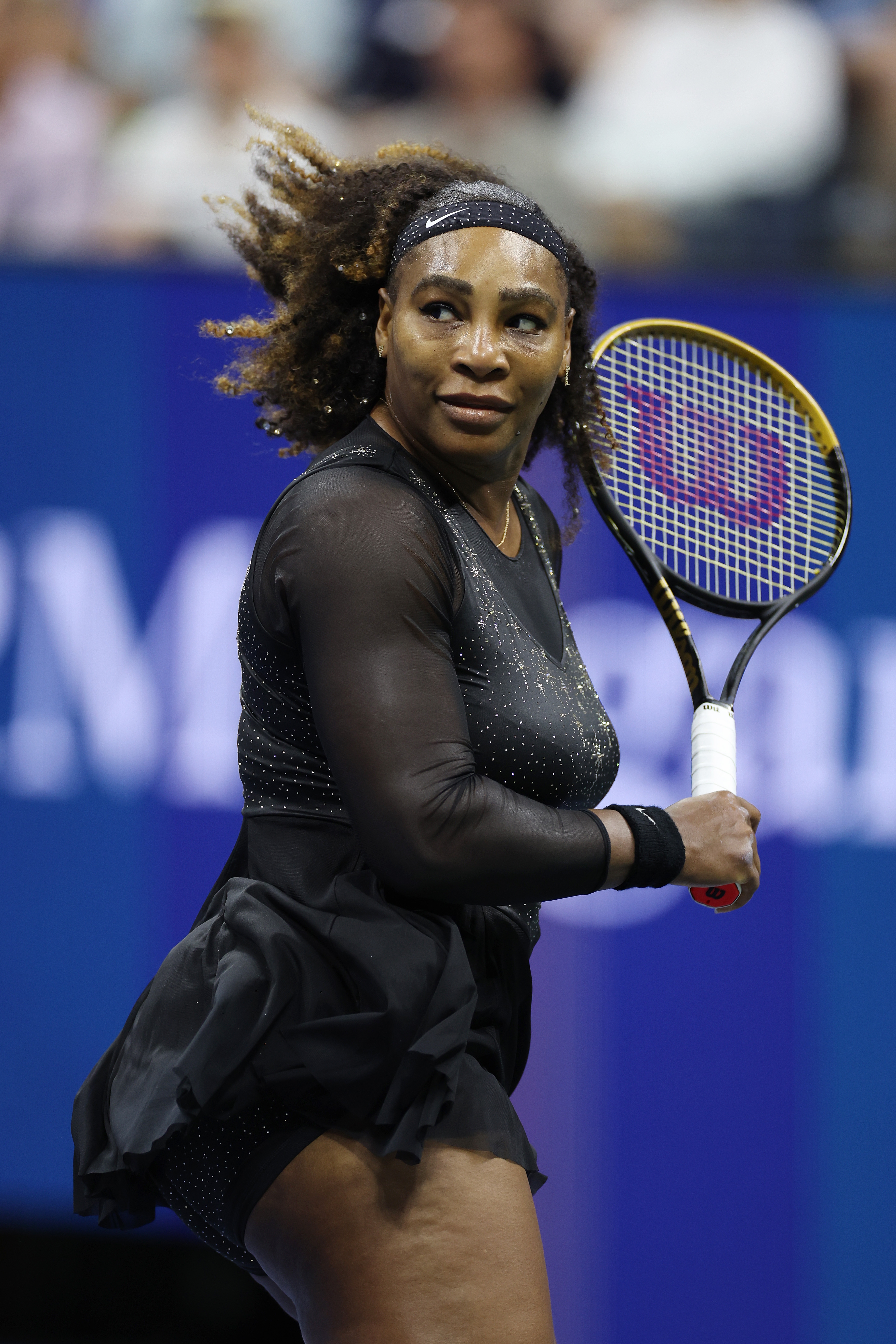 Tennis subordinate    successful  a sparkling achromatic  outfit holds a tennis racket connected  court, focused and acceptable   to play