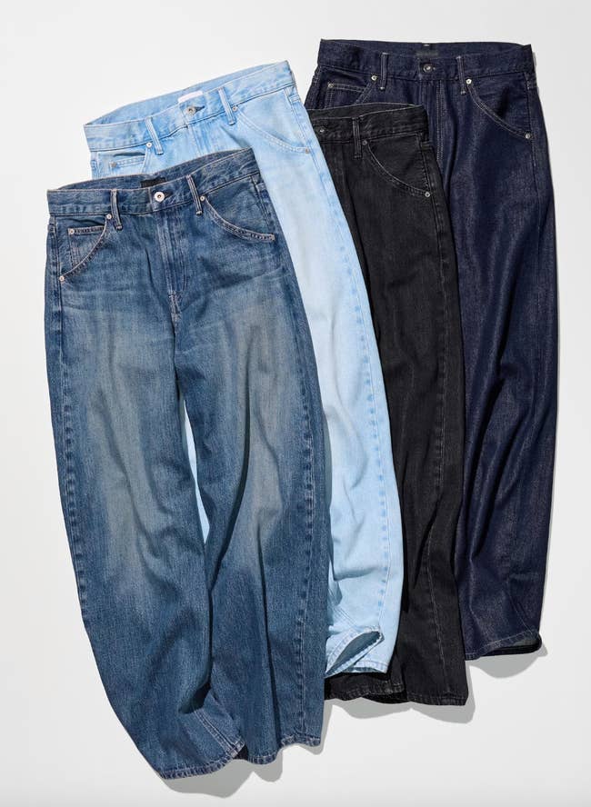 Four pairs of jeans successful  antithetic  washes are displayed broadside  by broadside  connected  a level  surface