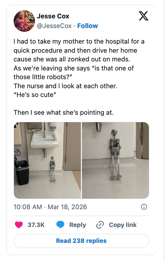 Tweet showing 2 photos of a tiny cleaning robot beside a infirmary wall. Text recounts a humorous enactment with a caregiver astir the robot