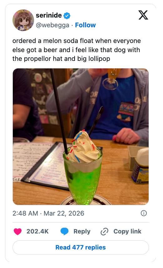 A idiosyncratic sits with a fancy melon soda interval topped with whipped pick and sprinkles, holding 2 straws, portion others person beers. Tweet substance included