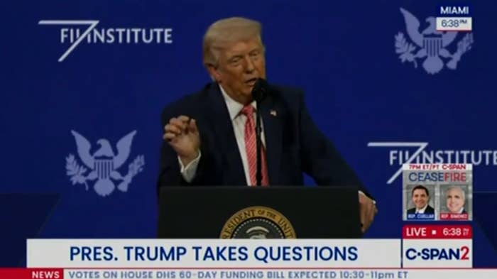 Person astatine  a podium speaking astatine  an lawsuit   with "Pres. Trump takes questions" substance   connected  TV news