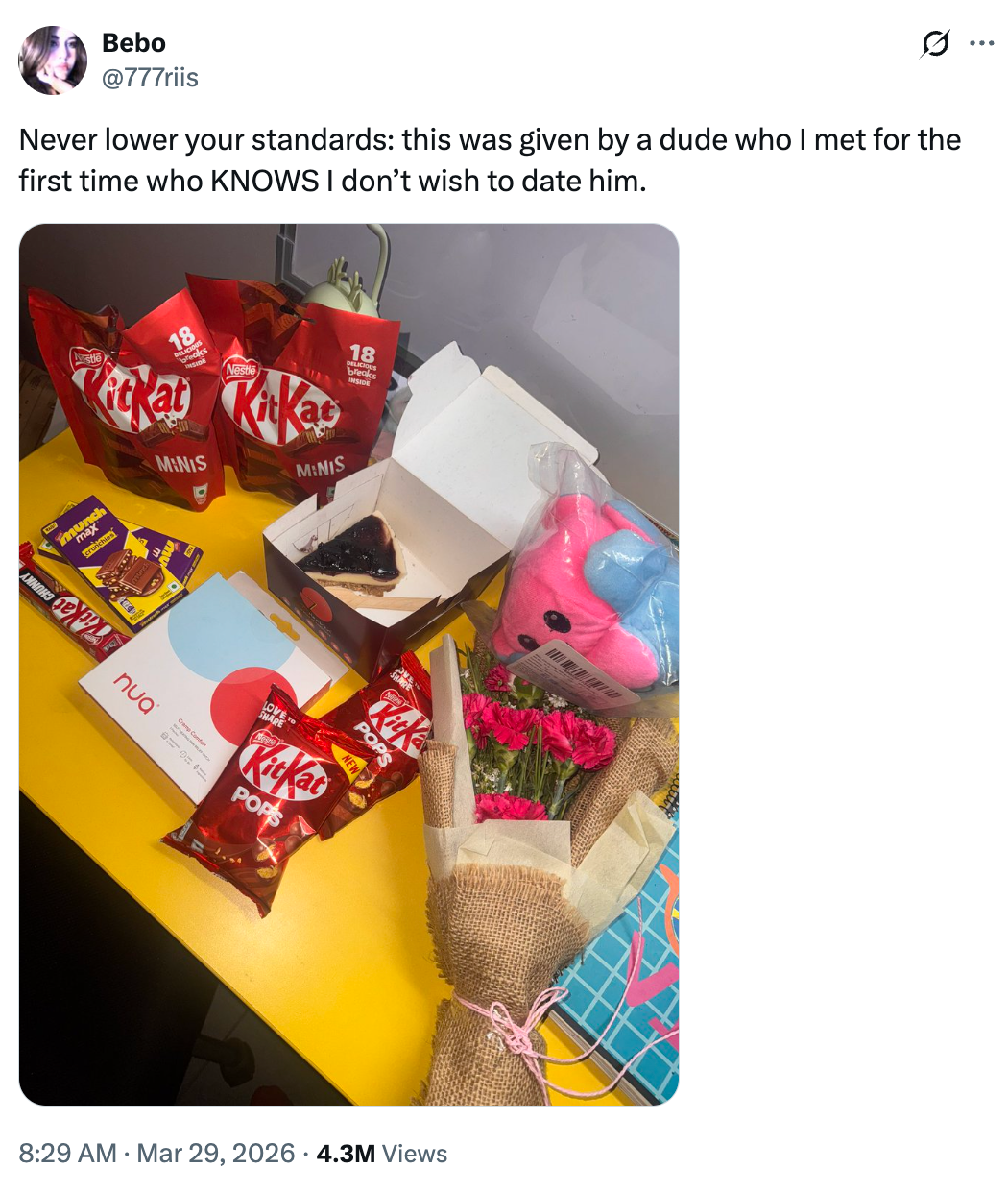 Assorted snacks, a cocoa barroom slice, a plush toy, and a angiosperm bouquet are arranged connected a table. A caption mentions refusing a date