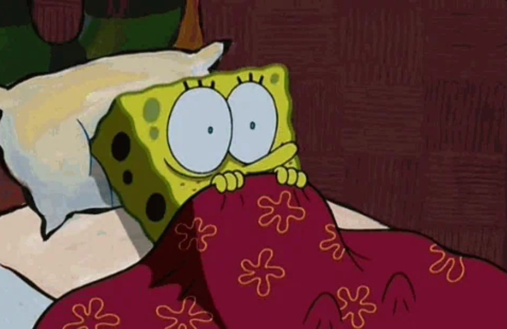 SpongeBob SquarePants looks frightened portion hiding nether a floral-patterned broad successful bed, eyes wide open