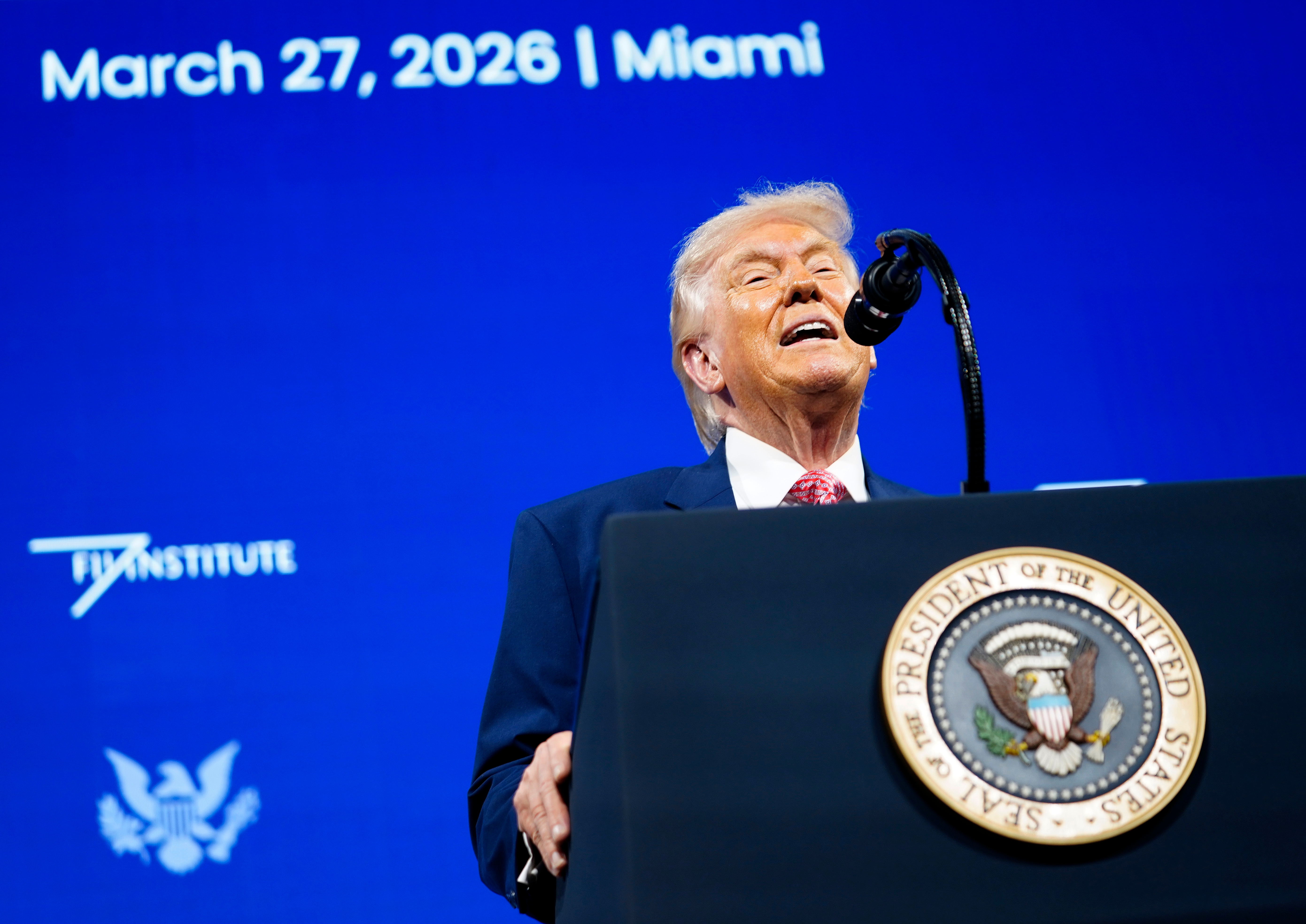 A nationalist fig speaks astatine a podium with the U.S. statesmanlike seal, against a backdrop speechmaking "March 27, 2026 | Miami."