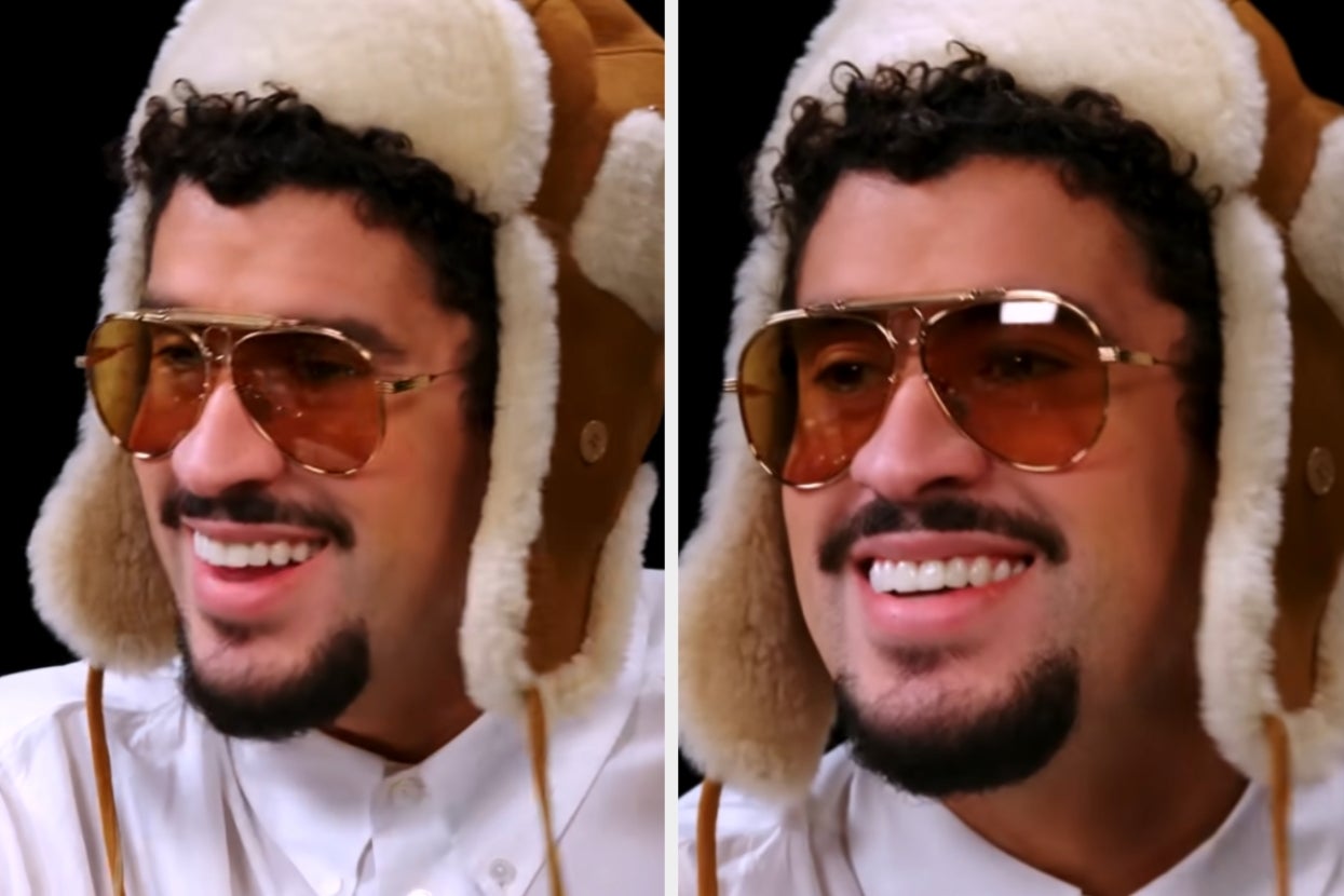 Person wearing a furry winter hat, sunglasses, and a white shirt, smiling