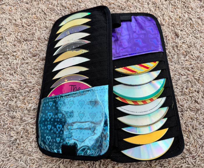 Open CD lawsuit  with aggregate  discs successful  sleeves connected  a carpeted floor