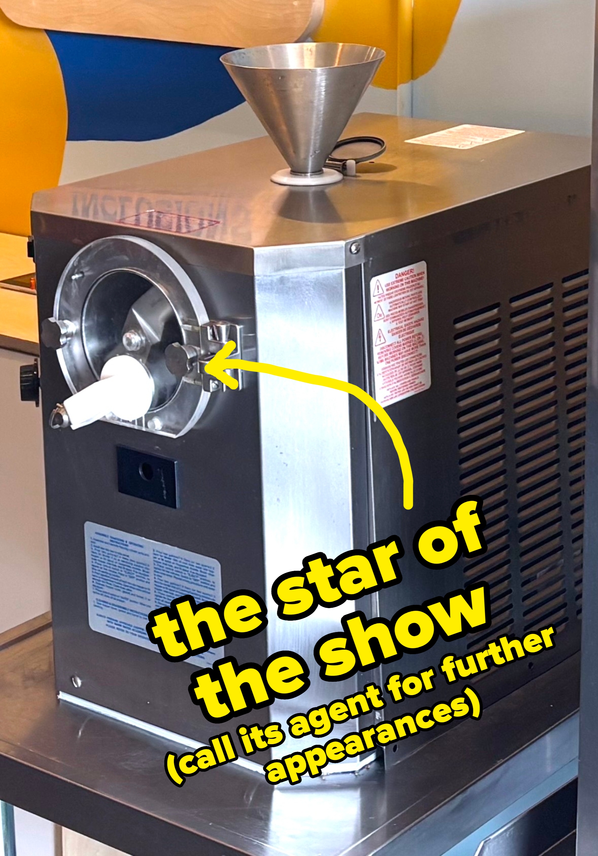 Commercial crystal  pick  instrumentality   with a metallic  assemblage  and funnel connected  top, placed connected  a antagonistic  successful  a kitchen