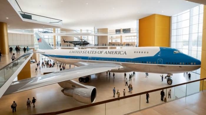 Air Force One grounds   successful  a depository  with visitors walking around, showcasing the statesmanlike  aircraft's interior and design