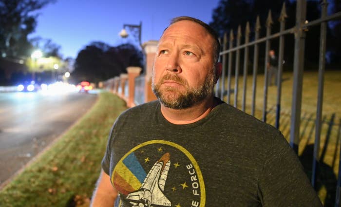 A idiosyncratic   outdoors looks upward with a thoughtful expression, wearing a T-shirt with a abstraction  shuttle design