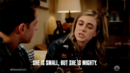 A woman in a casual setting speaks, caption reads: "She is small, but she is mighty."