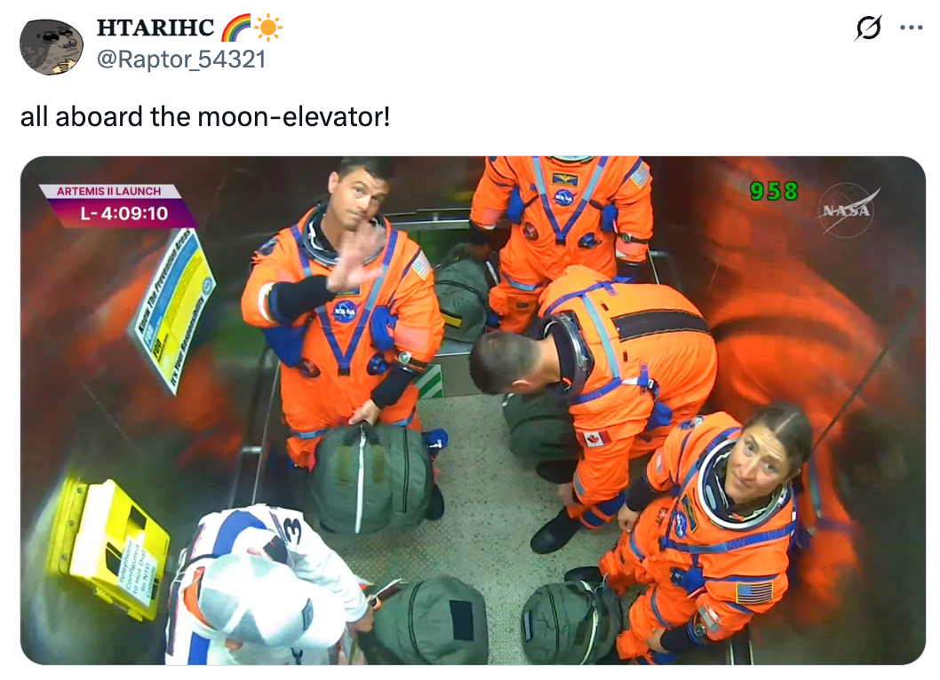 Astronauts successful  orangish  suits basal   wrong  an elevator, preparing for a abstraction  mission