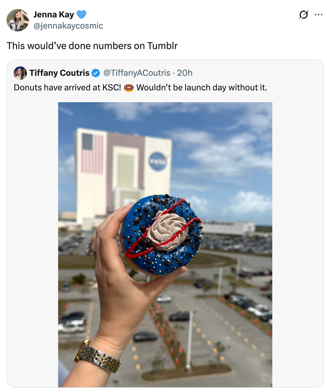 A manus  holds a donut topped with space-themed decorations extracurricular  a ample  gathering  astatine  Kennedy Space Center