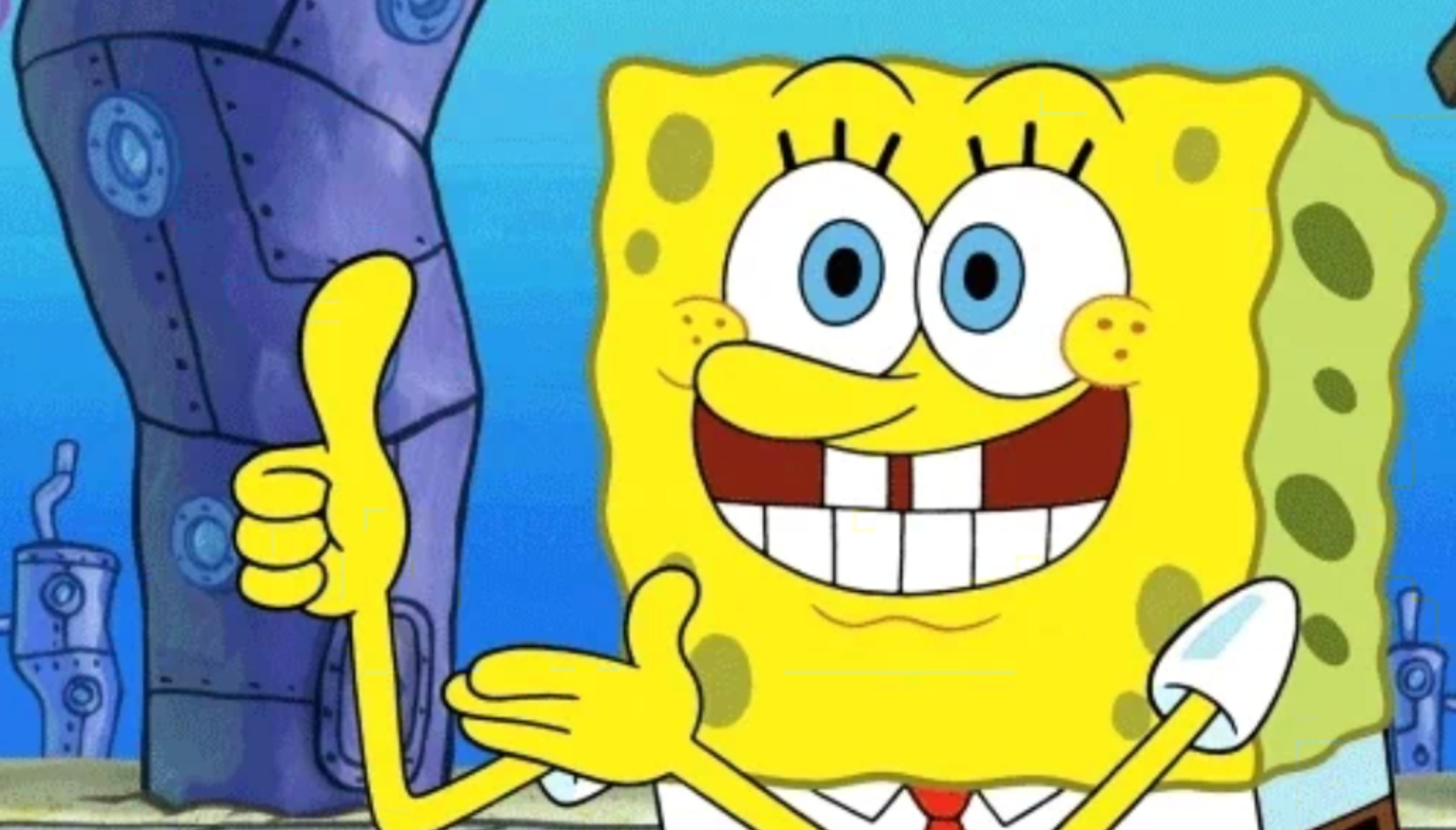 SpongeBob SquarePants smiler og gir tommel opp med bygninger i bakgrunnen