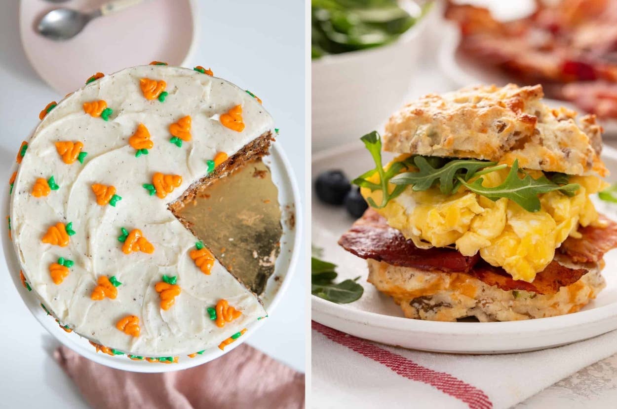 A carrot cake with a slice missing and a bacon, egg, and arugula biscuit sandwich displayed side by side