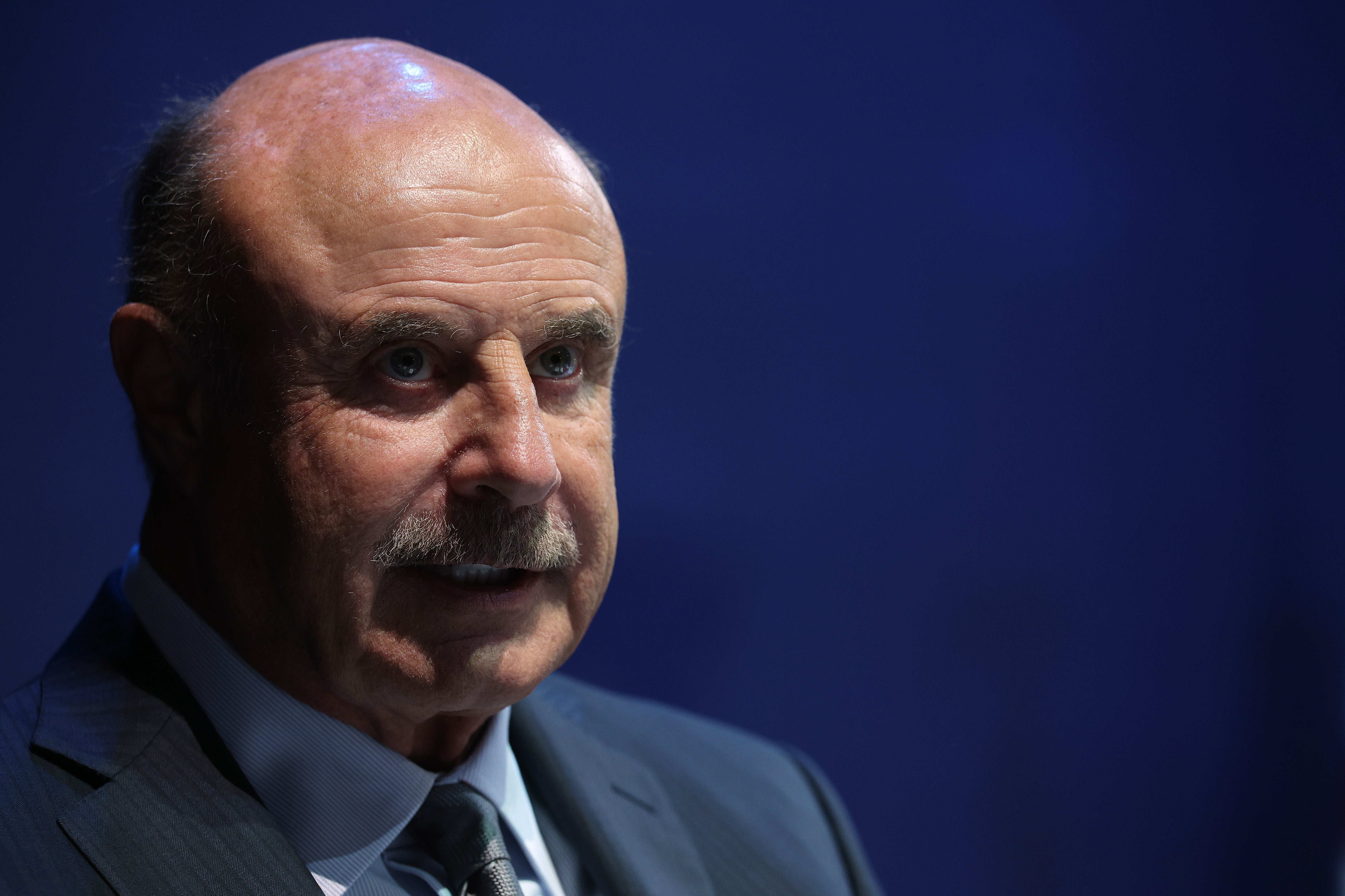 Man successful  suit   and necktie  with a superior   look  astatine  a ceremonial  event