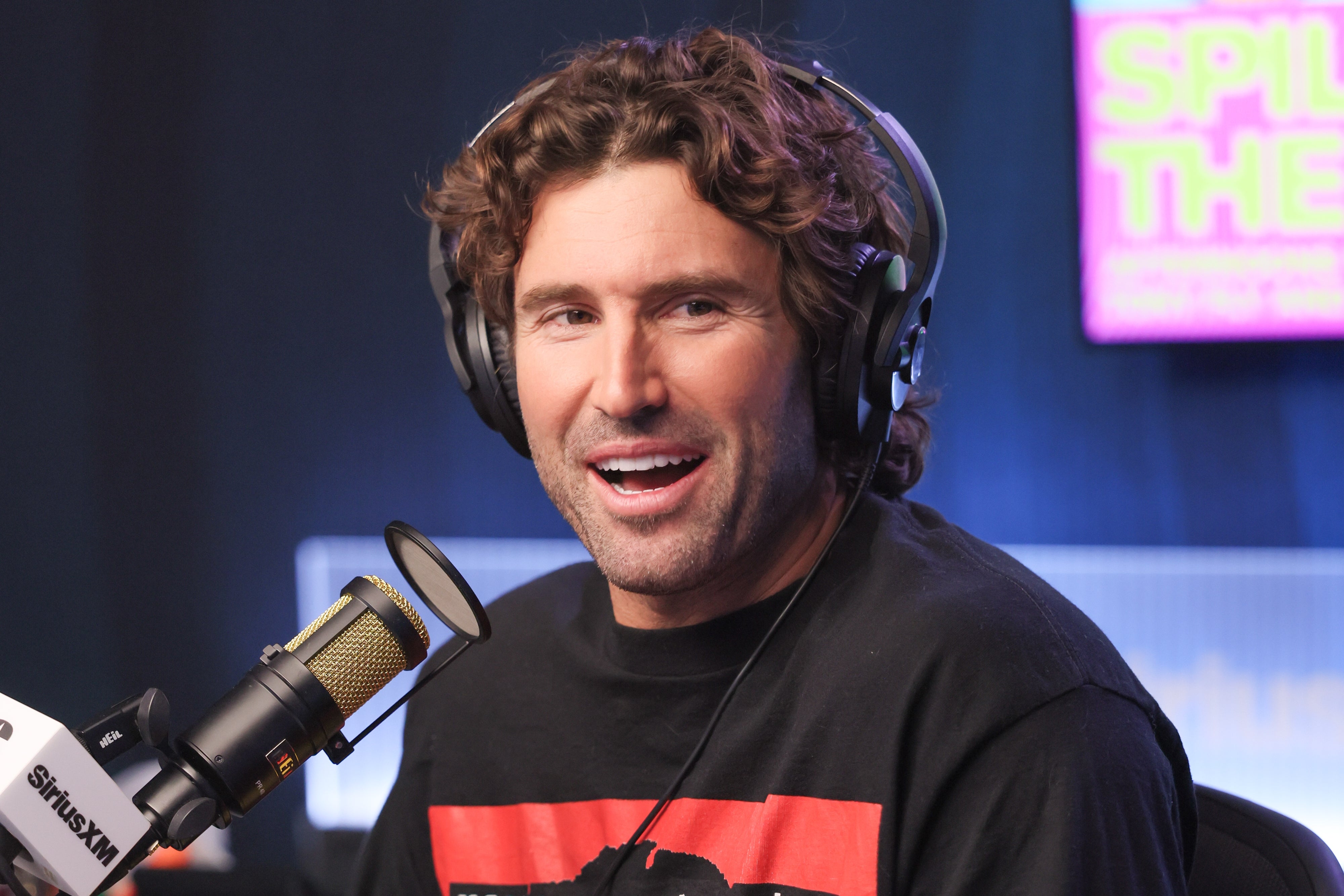 Person wearing headphones speaks into a microphone during a vigor   show