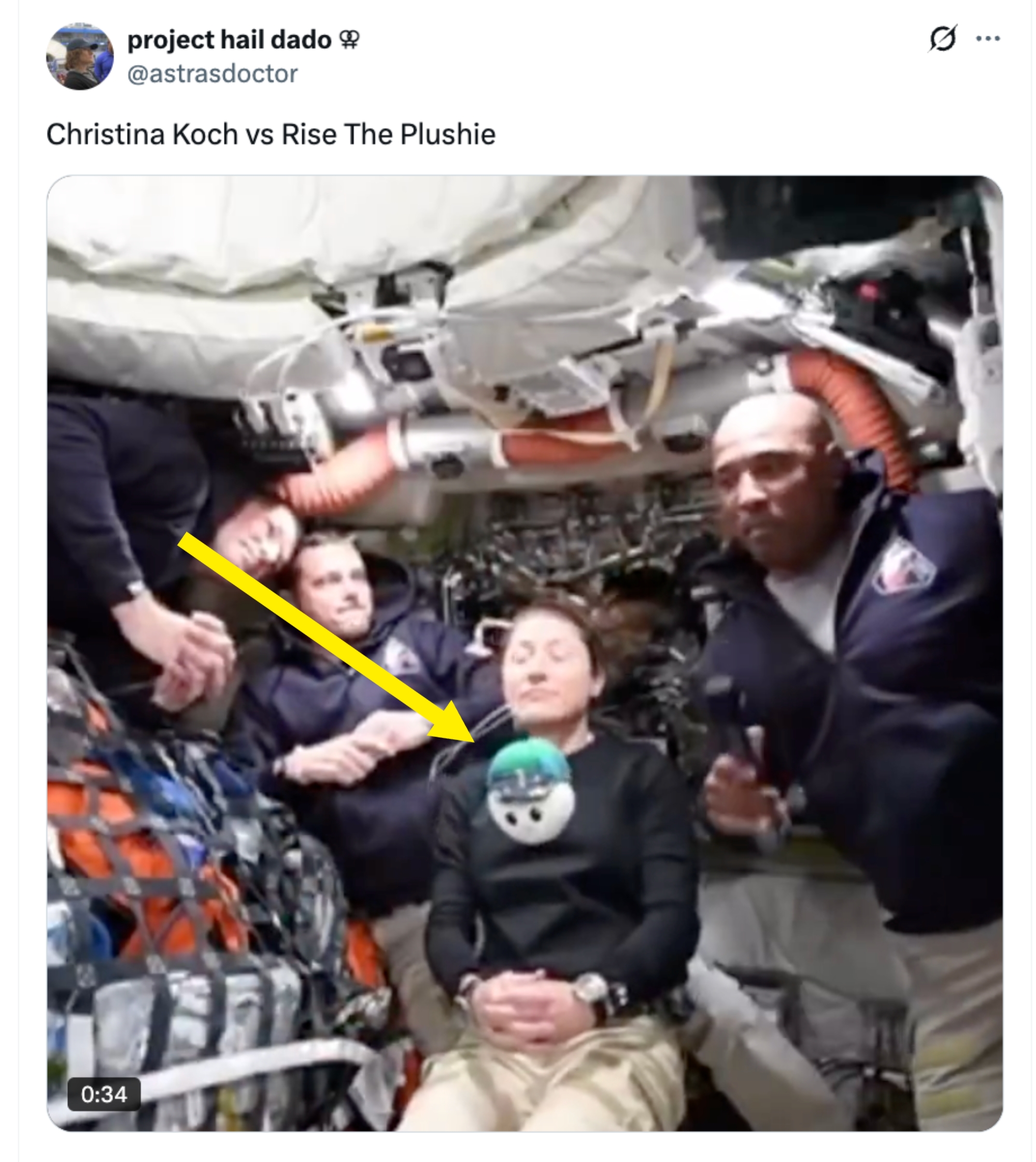 Four astronauts airs wrong a spacecraft, with 1 holding a plush toy. The mounting appears method and engaged with equipment