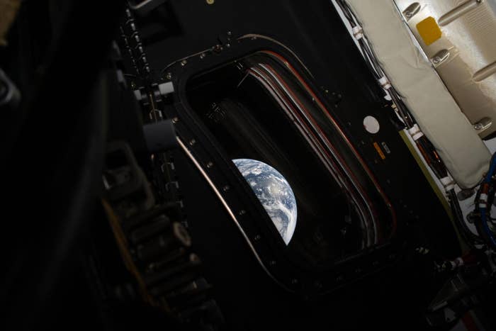 View of Earth done  a spacecraft window, showcasing the satellite  from abstraction  successful  a serene, isolated setting