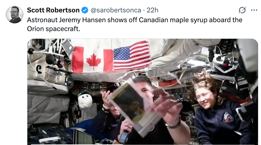 Astronauts wrong a spacecraft amusement disconnected Canadian maple syrup, with a Canadian emblem successful the background