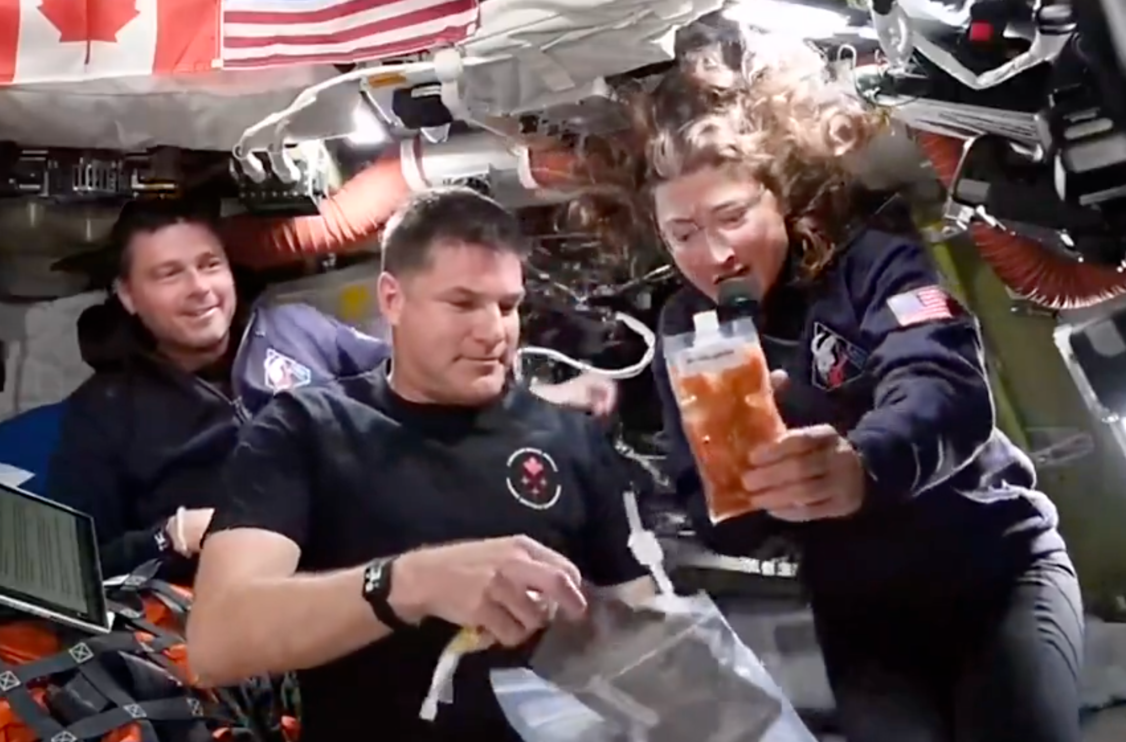 Astronauts interval wrong a spacecraft, interacting with nutrient packets and equipment, showcasing beingness successful zero gravity