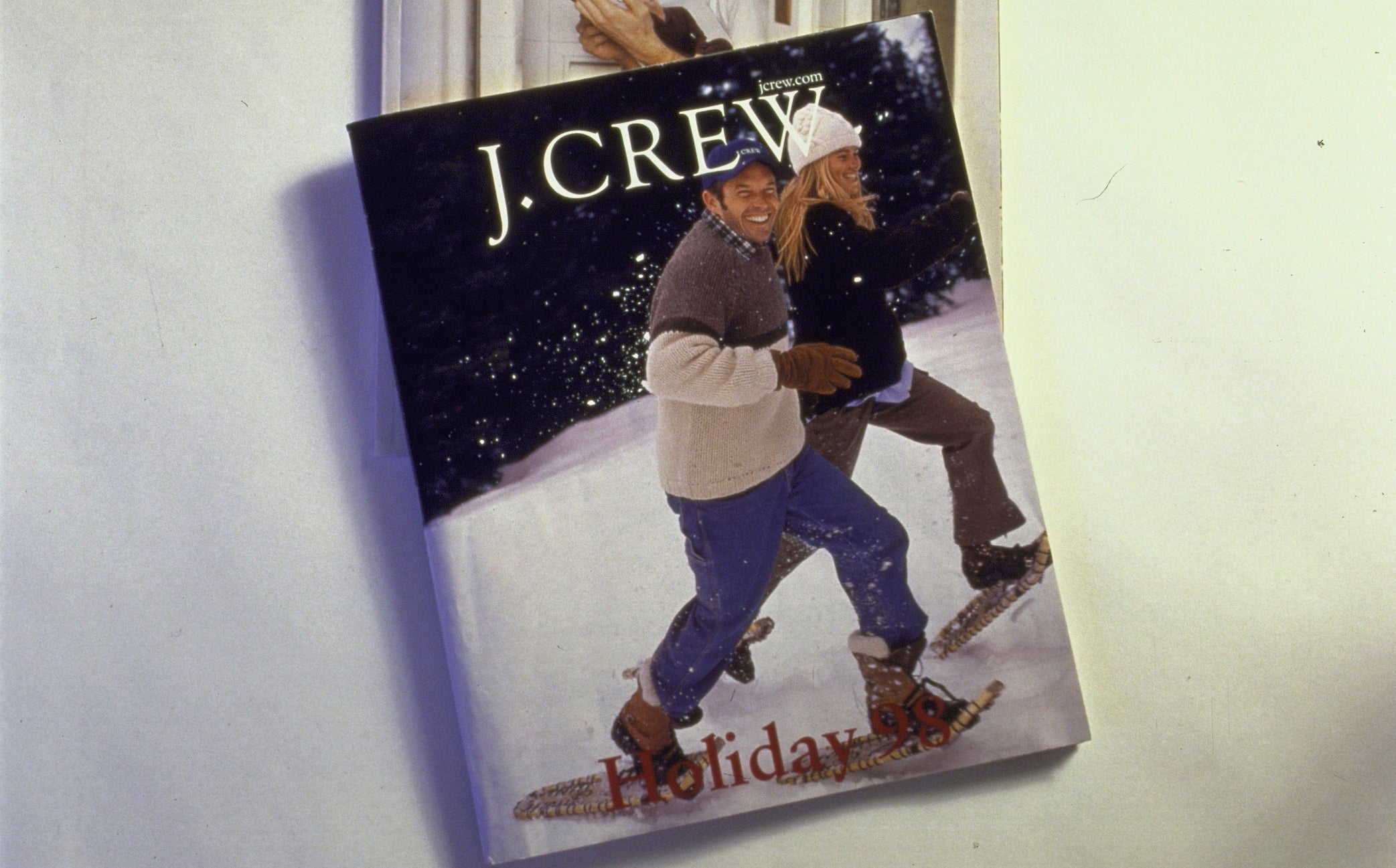 Two retro J.Crew catalogs, 1 showing a antheral successful wintertime attire and the different with a skier, marked with "A Memoir" connected top