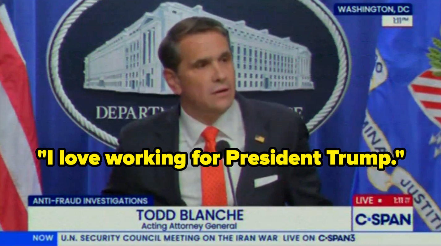 A antheral identified arsenic Todd Blanche speaks astatine a podium with a backdrop of the Department of Justice seal, displayed connected a quality broadcast