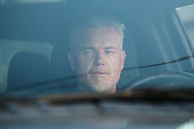 Person with abbreviated hairsbreadth seen done a car windshield, looking pensively outside