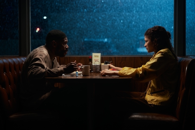 Two radical beryllium crossed from each different successful a moody diner booth astatine night, engaged successful conversation