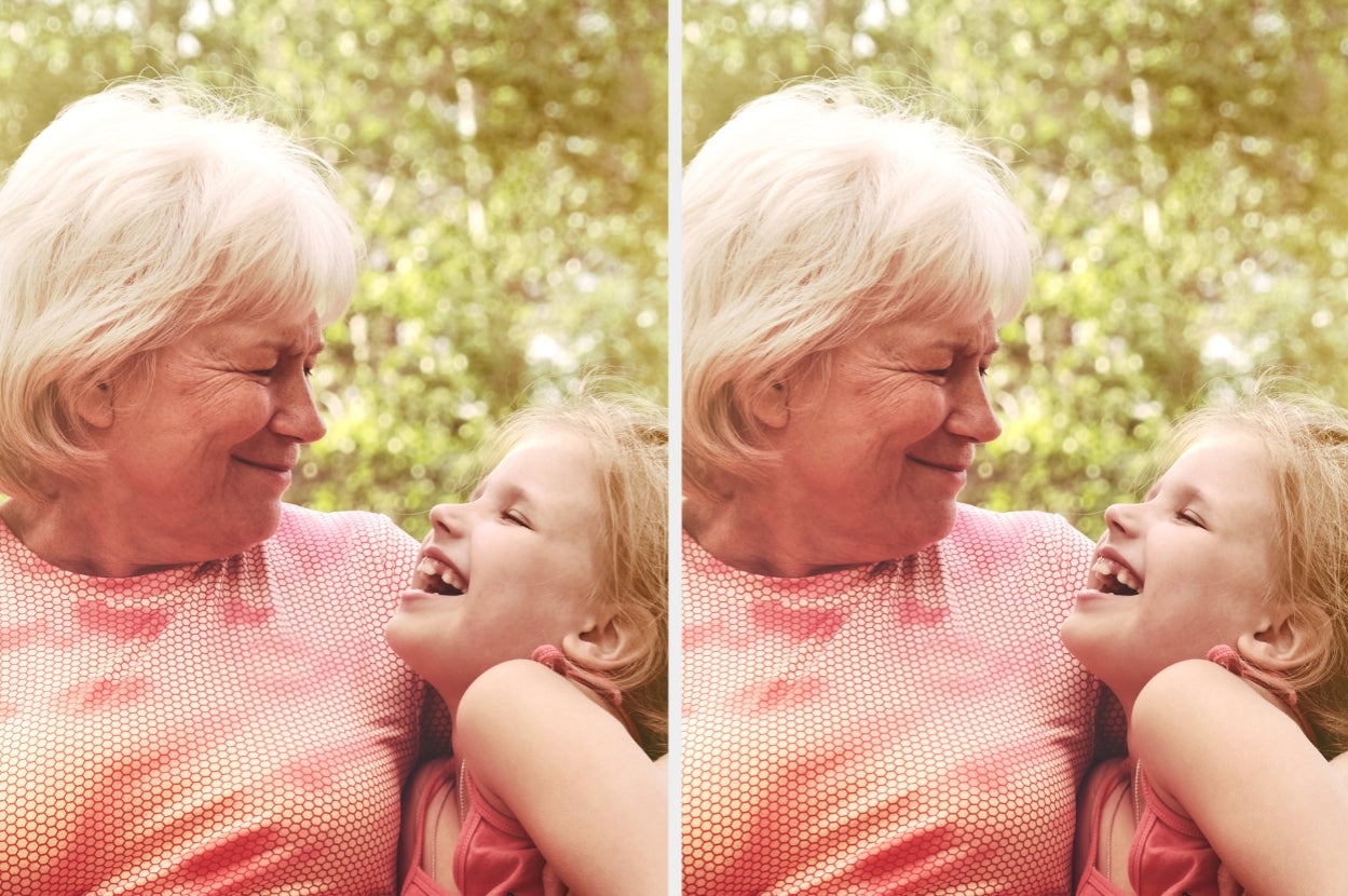 Grandmother and granddaughter smiling and laughing together, sharing a joyful moment outside