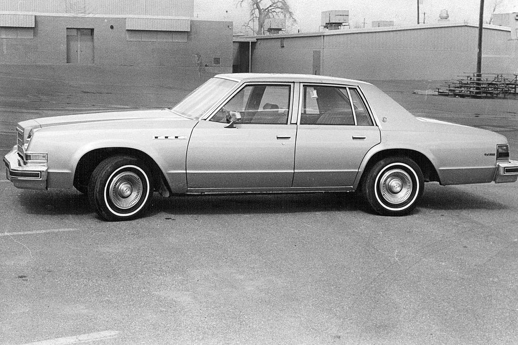 Vintage Buick sedan parked successful a lot, captured successful a broadside view. Retro style, classical design