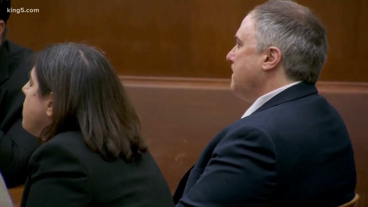 A antheral and a pistillate beryllium broadside by broadside successful a ceremonial setting, facing forward. Both are successful concern attire, appearing attentive