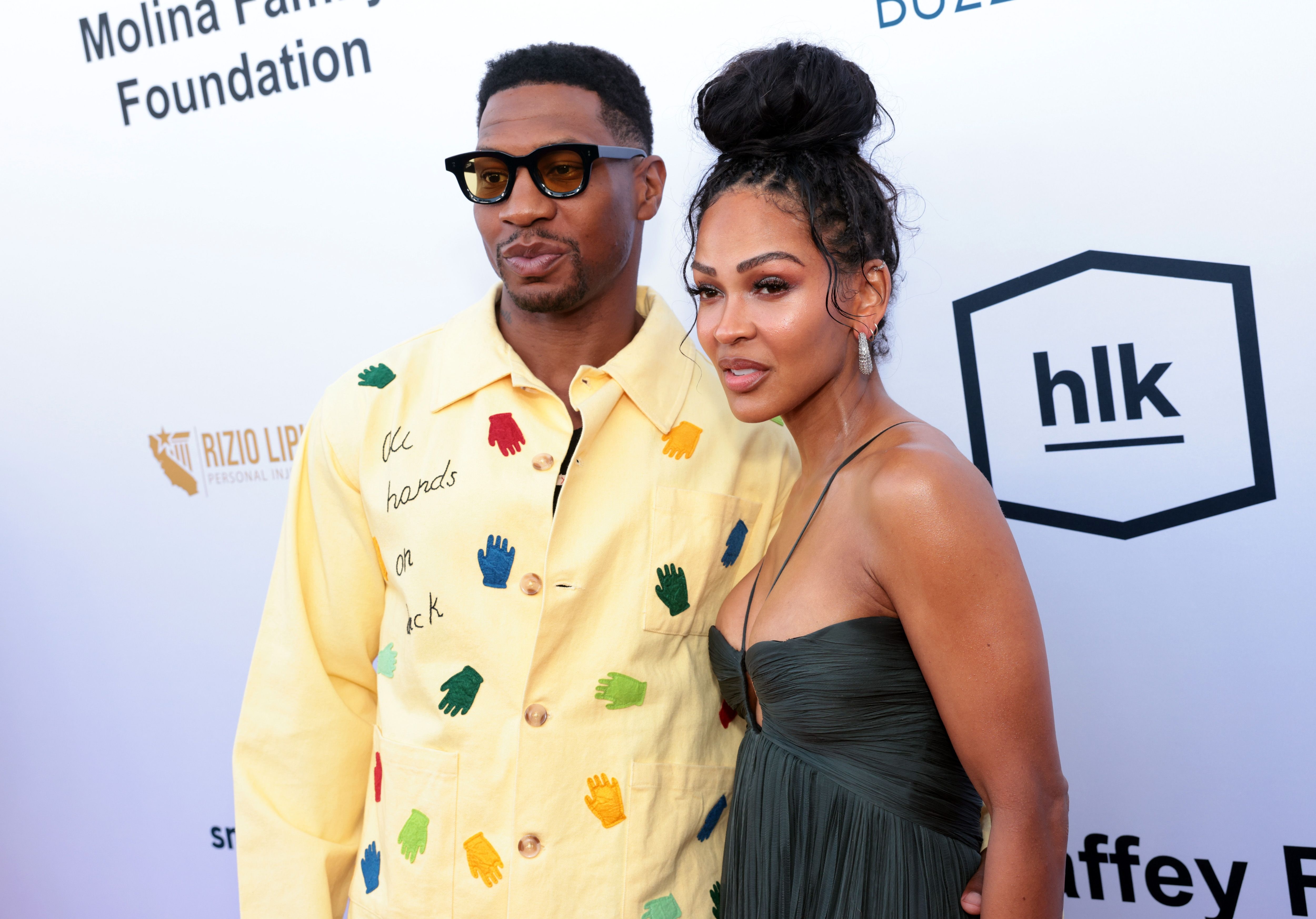 Jonathan Majors successful a patterned garment and Meagan Good successful a strapless formal airs unneurotic astatine a personage event