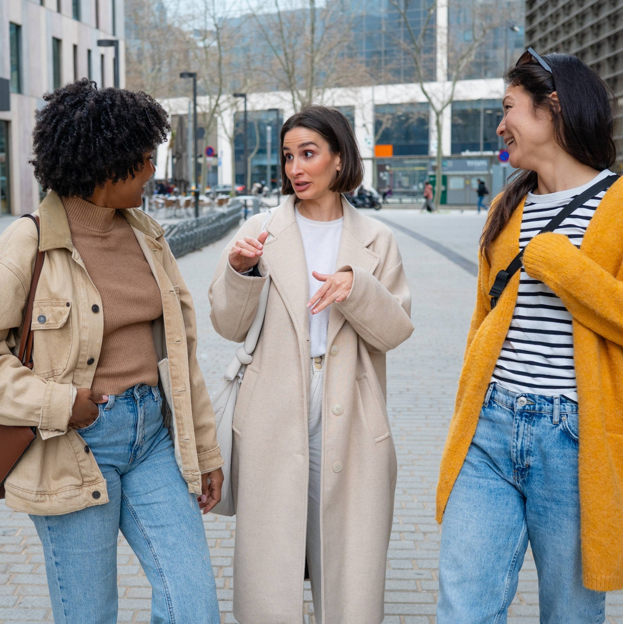 Three people chatting on a city street, one gesturing while others smile. Overlaid text: "Started treating my social life like something that needs maintenance."