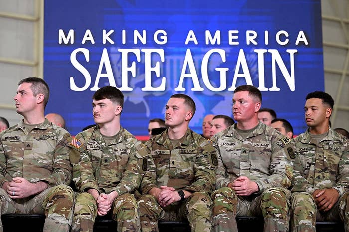 Five soldiers successful  azygous   beryllium   successful  beforehand   of a motion   reading, "Making America Safe Again," during an event