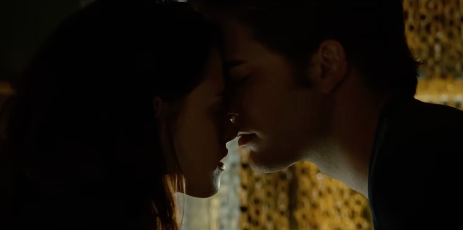 Two radical are leaning successful for a kiss, their faces adjacent unneurotic successful an intimate moment