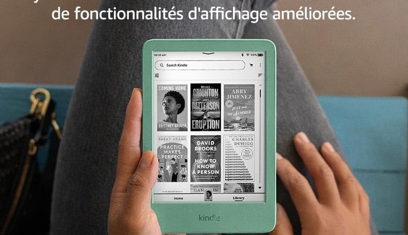 Person holding a Kindle with enhanced display features, showing book covers. Features highlighted: glare-free display, adjustable front light, long battery life