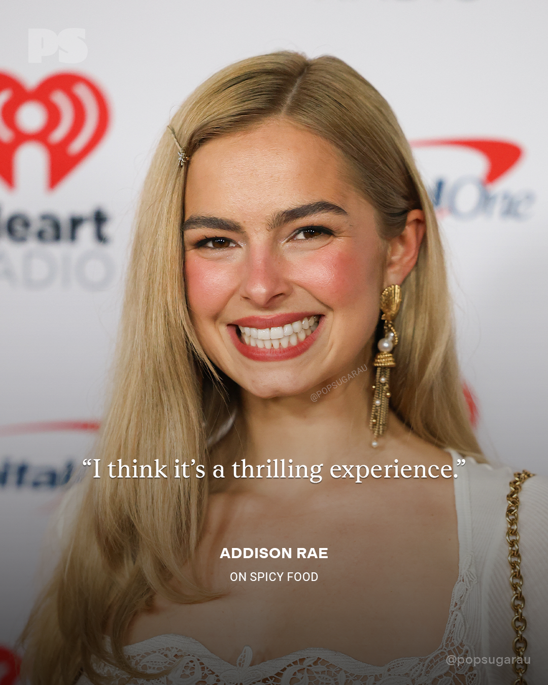 Person smiling astatine  an event, wearing elegant attire with connection    earrings. Accompanied by a punctuation  connected  spicy food, attributing it to Addison Rae