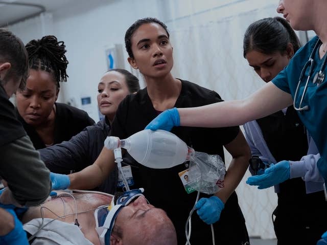 Medical squad  successful  a tense infirmary  scene, focusing connected  a diligent  connected  a stretcher, surrounded by nurses and doctors with urgent expressions