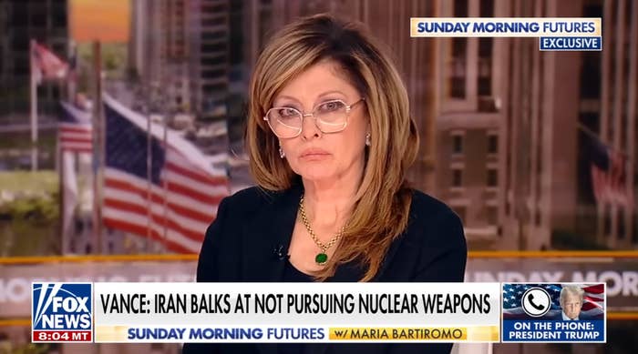 News anchor connected  Fox News reports astir  Iran's stance connected  atomic  weapons, with a impermanent  connected  the phone