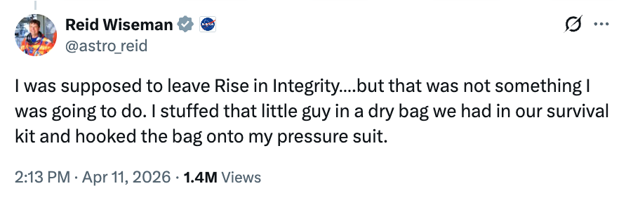 Tweet by Reid Wiseman astir keeping a "little guy" successful a adust container attached to his unit suit, with implicit 1.4M views
