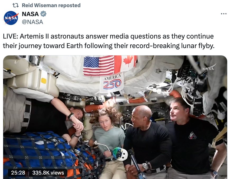 Astronauts wrong a spacecraft reply media questions during their travel to Earth aft a historical lunar flyby, surrounded by instrumentality and gear