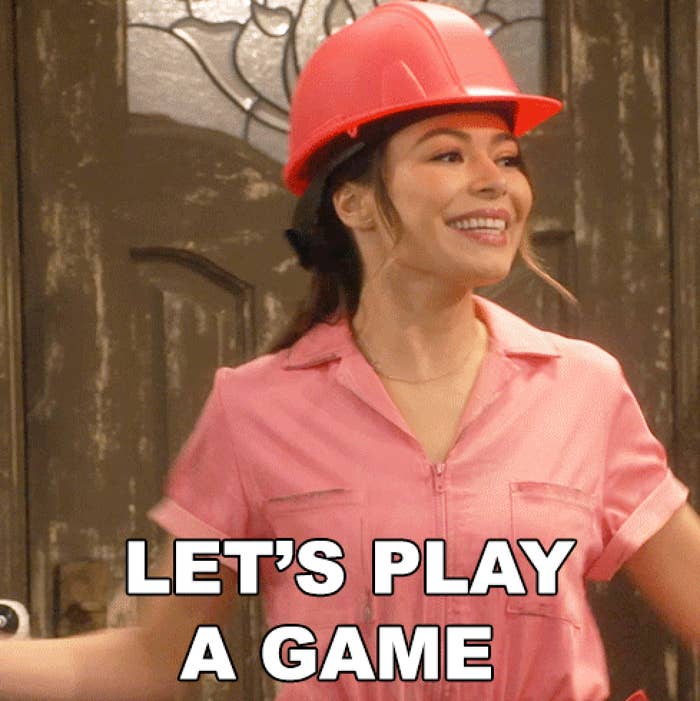 A idiosyncratic   wearing a pinkish  jumpsuit and a operation  helmet is smiling, with the substance   "LET'S PLAY A GAME" astatine  the bottom