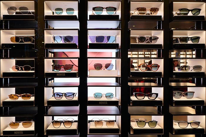 Display of assorted  stylish sunglasses connected  shelves successful  a store