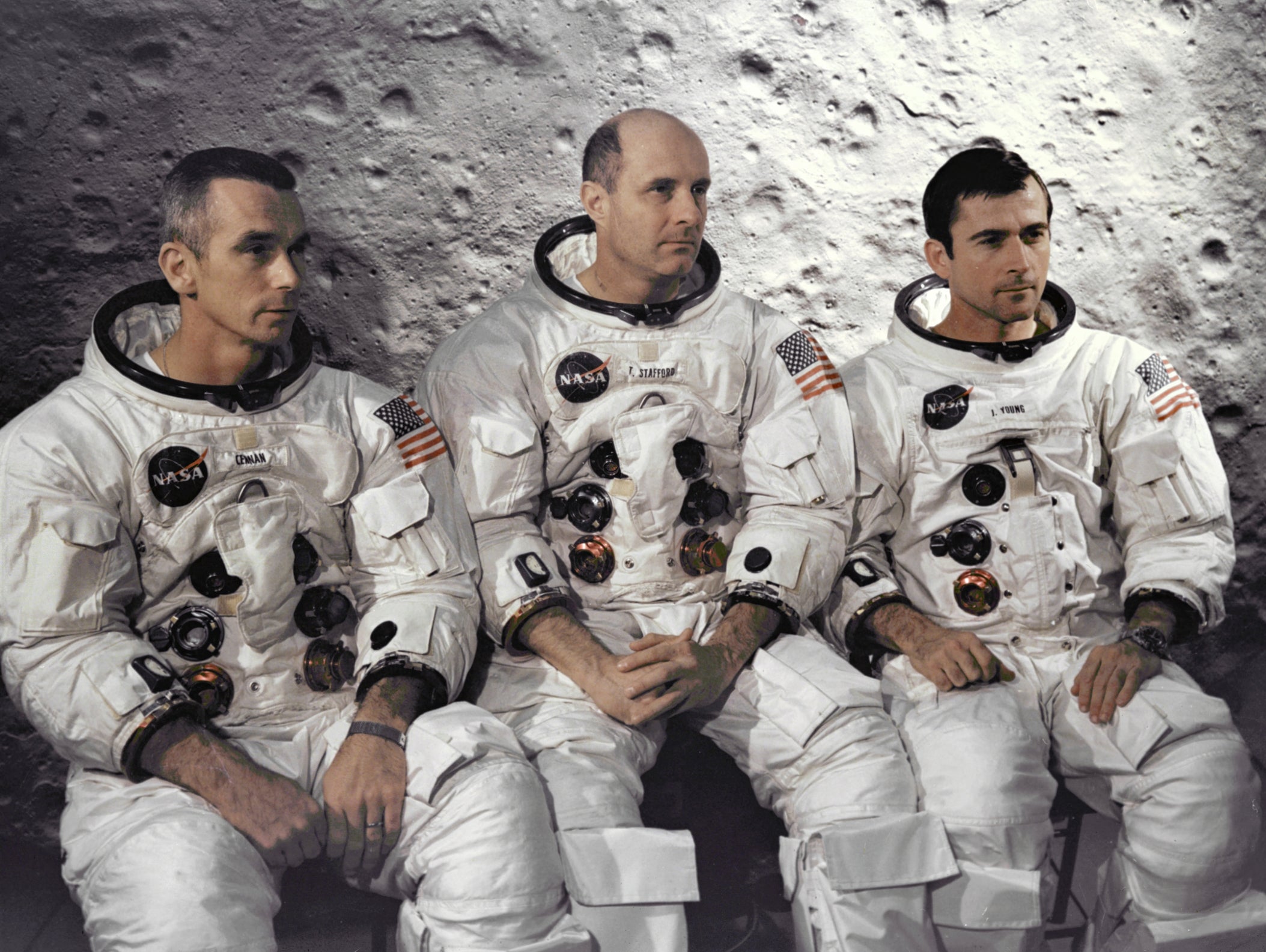 Three astronauts successful  NASA abstraction  suits beryllium   successful  beforehand   of a lunar backdrop, reflecting connected  abstraction  exploration history